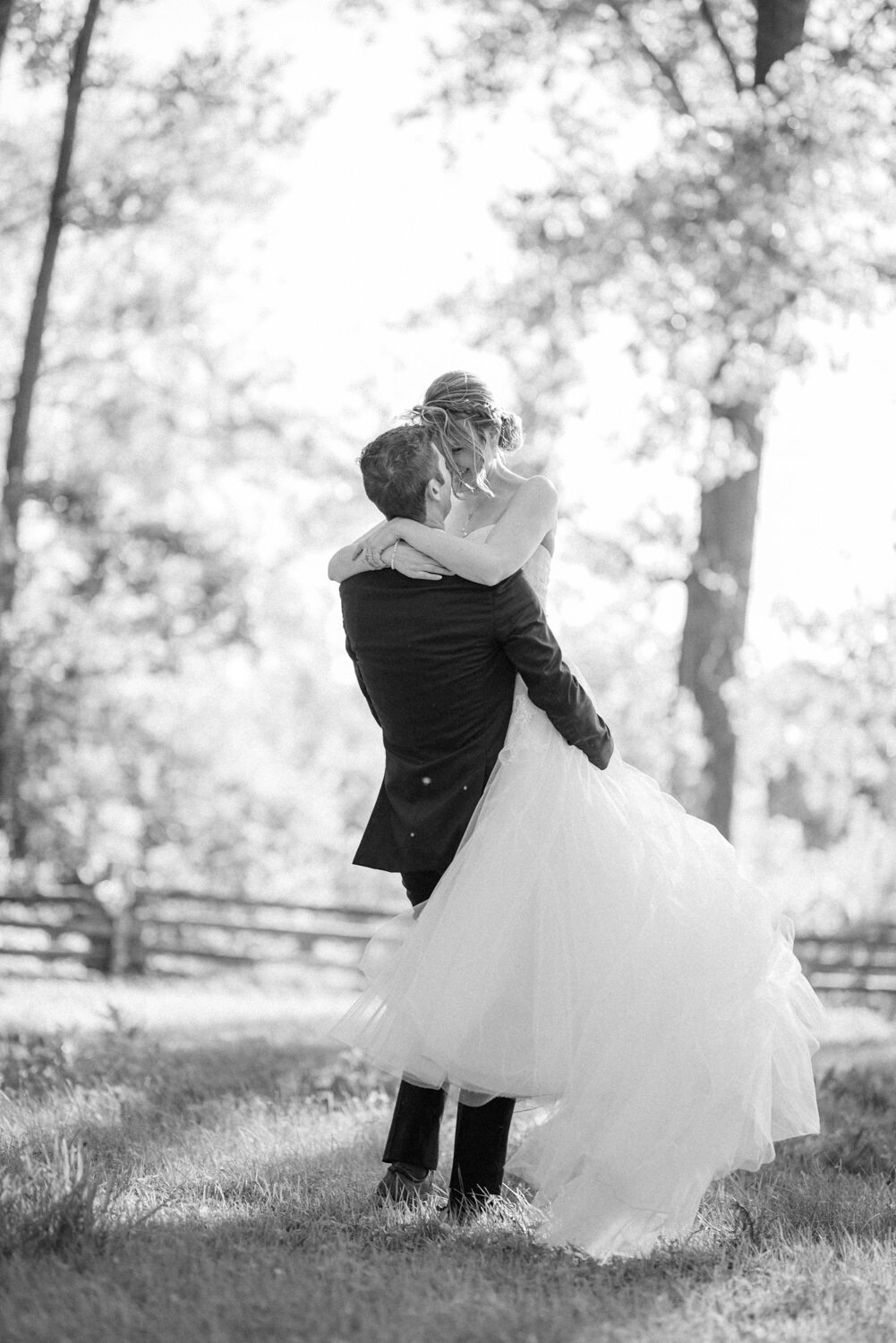 bride-carried-rustic-field-2