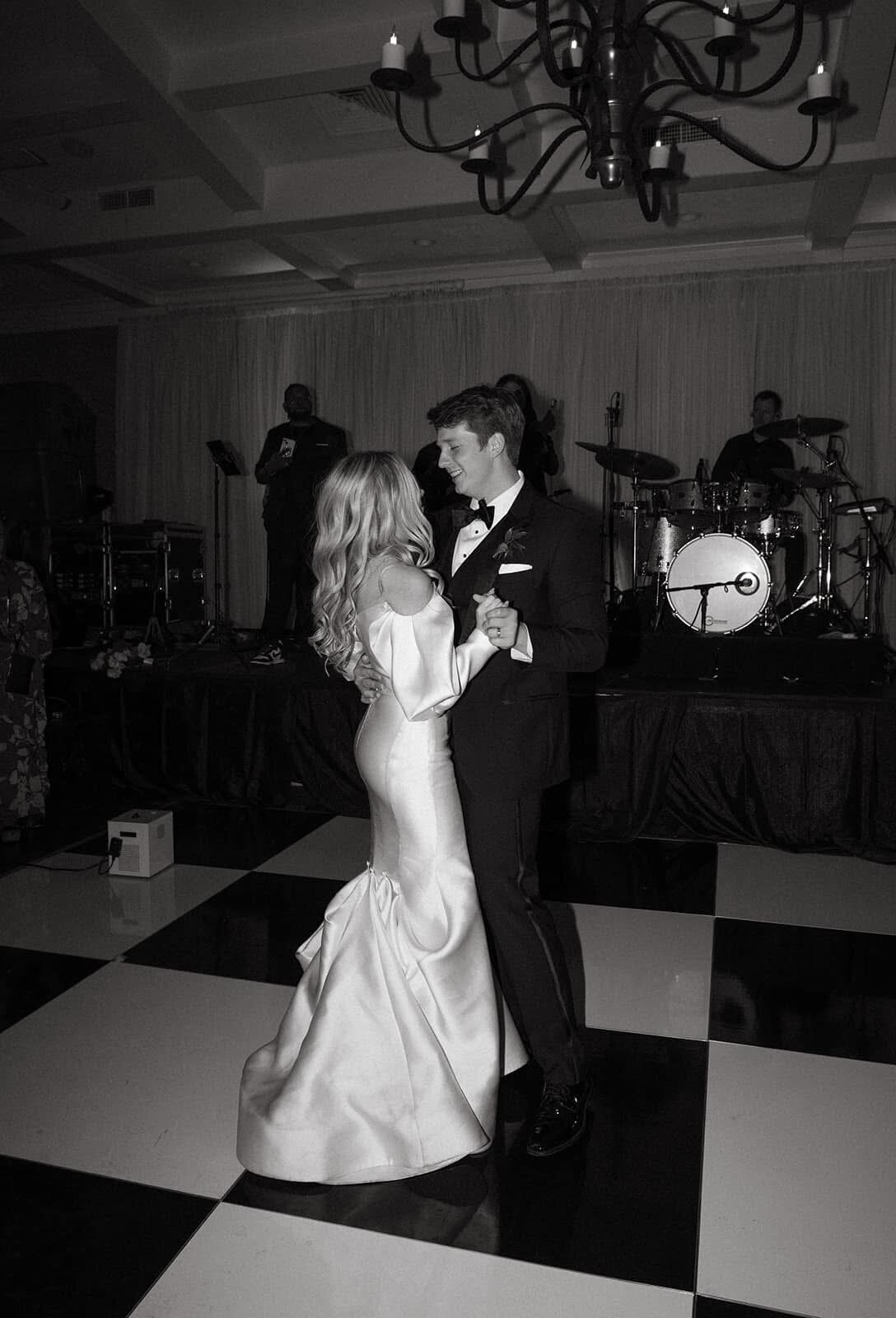 Candid first dance moment captured by destination wedding photographer Staci Brucks showing couple's genuine happiness