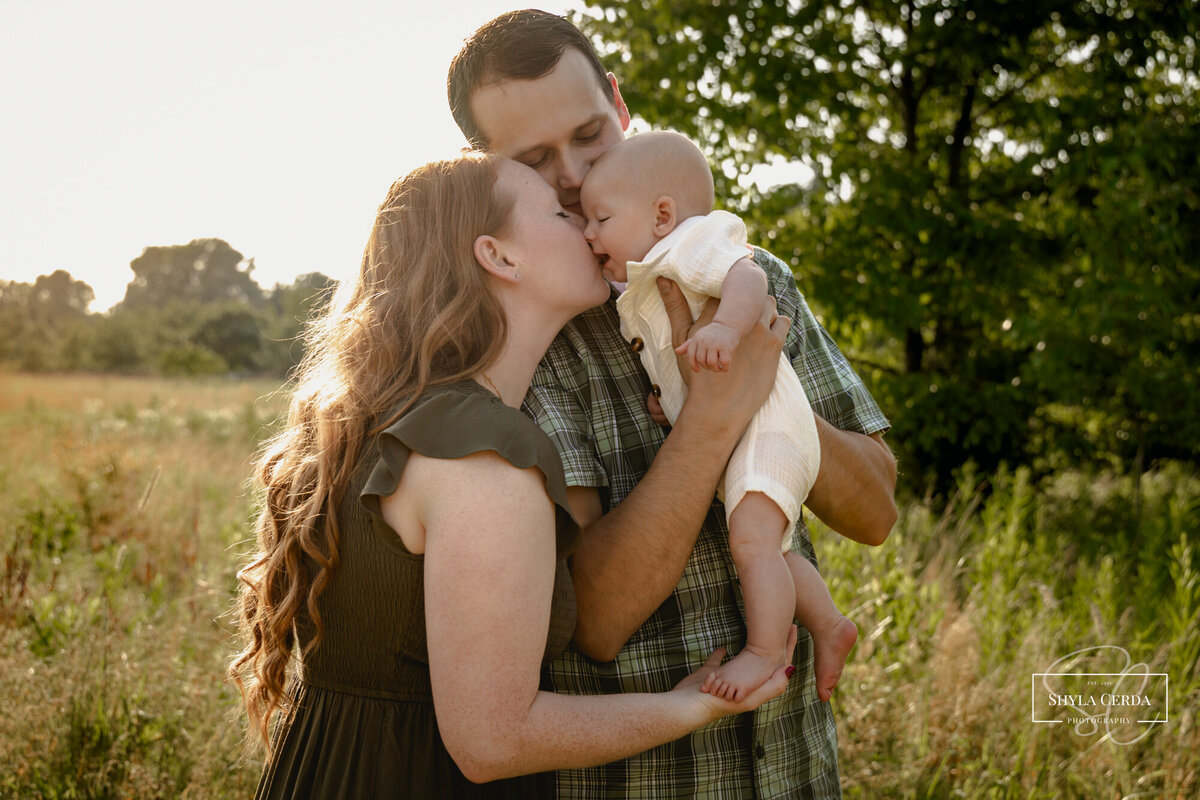 Mom kissing her 10 month old baby boy