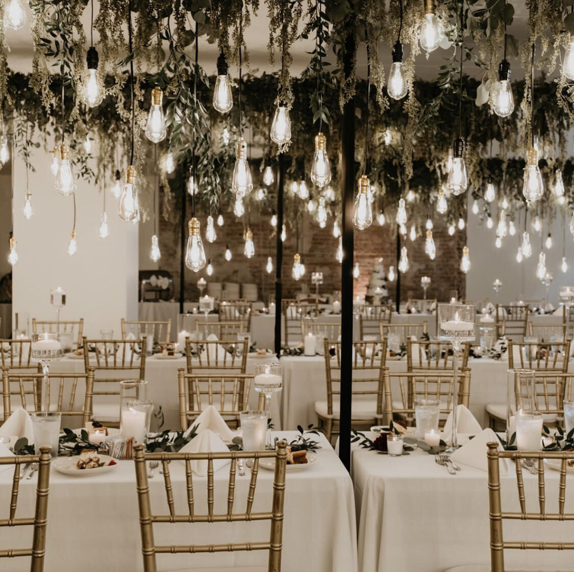 Over table lighting + greenery structures