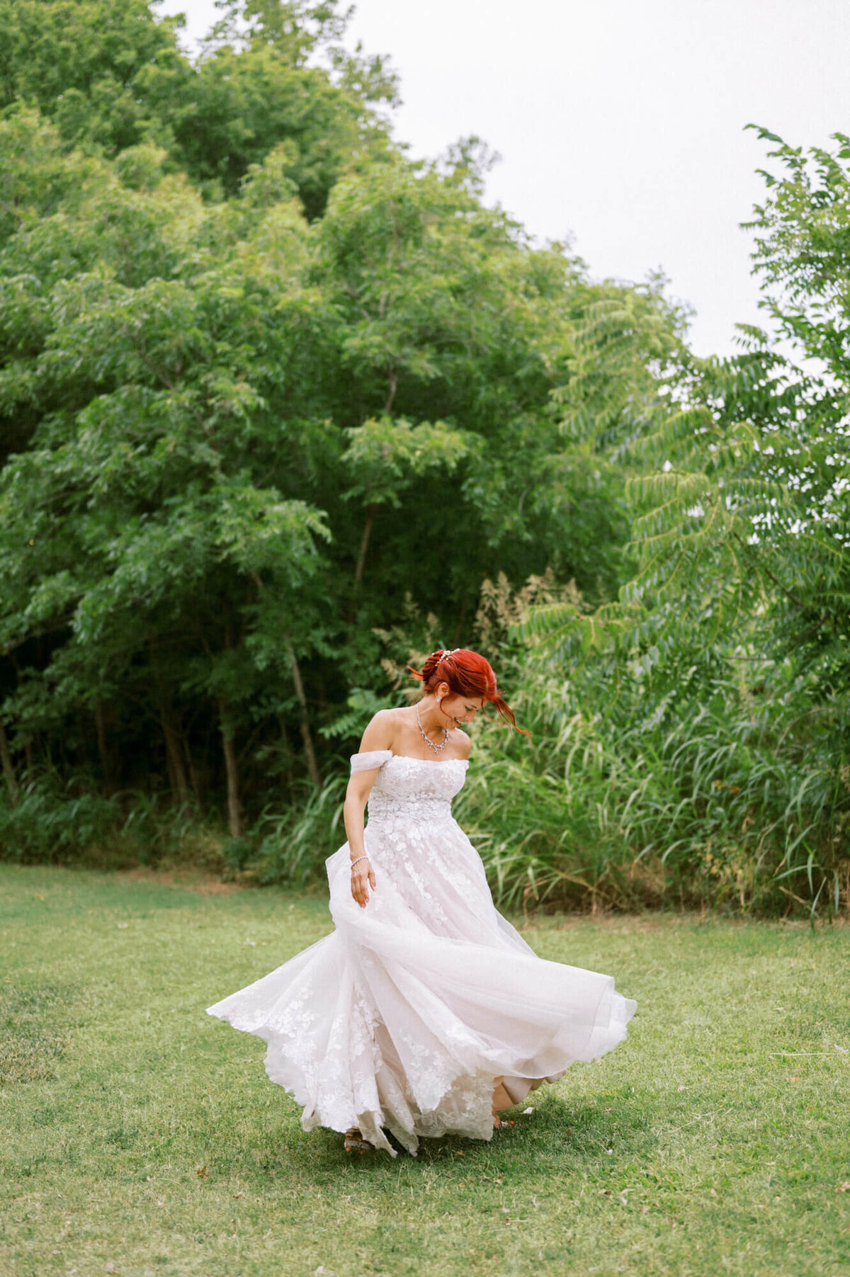 bride-twirling-in-the-grass