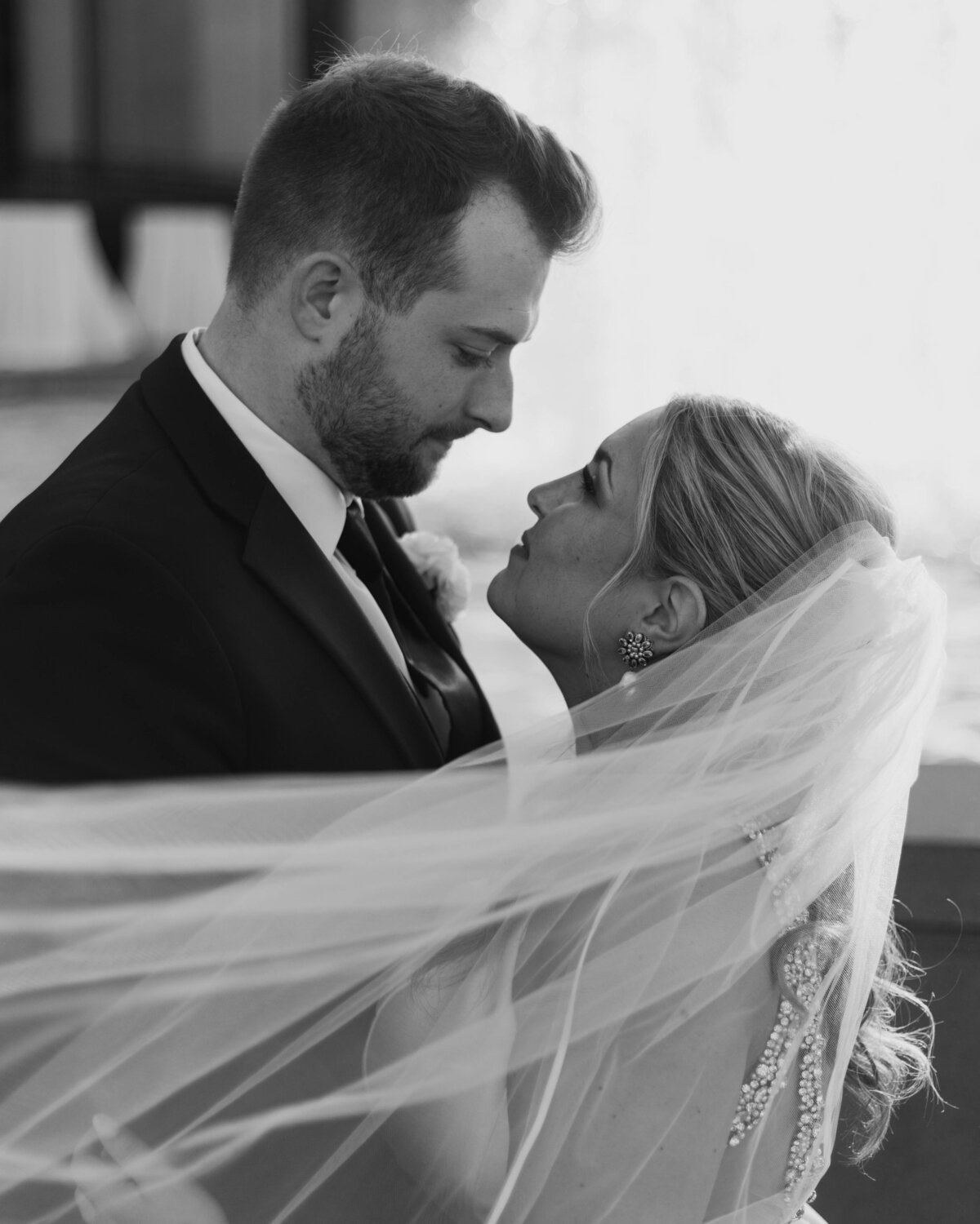 bride and groom veil shot