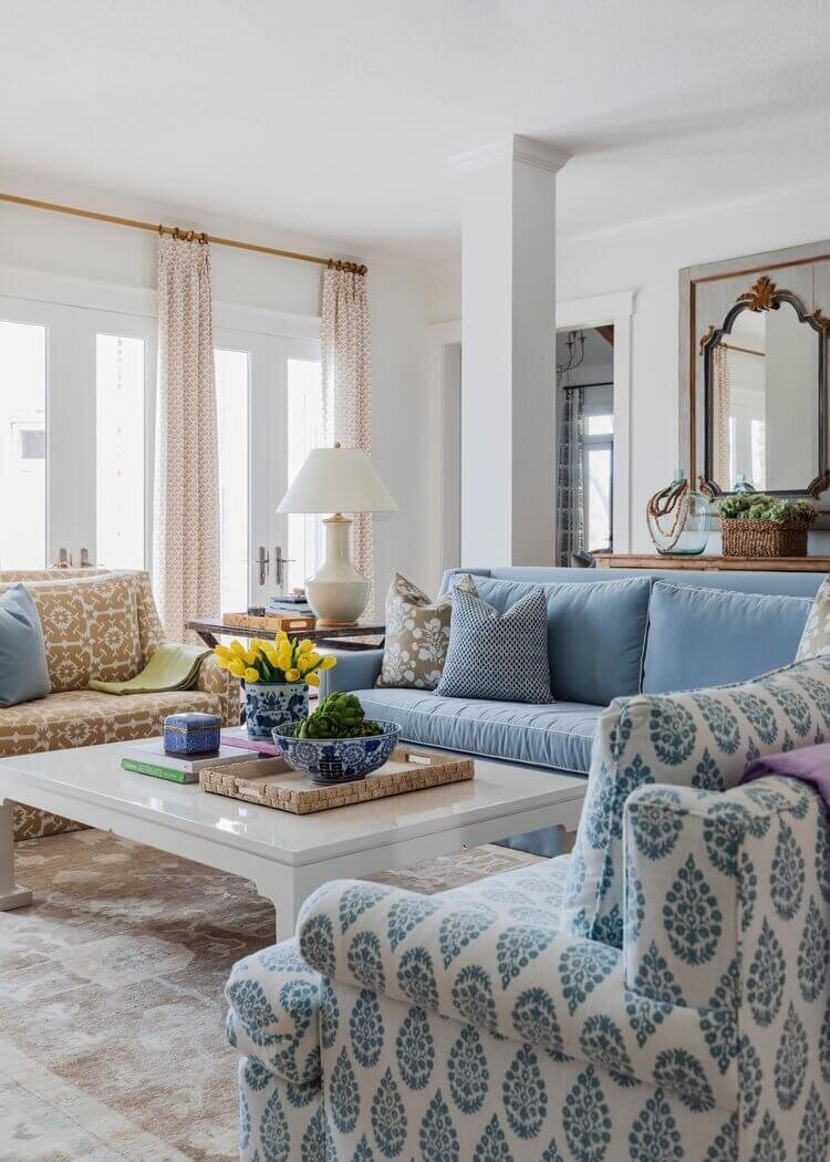 oyster creek studios home on the range blue and brown loveseats and sofa around a white coffee table in living room