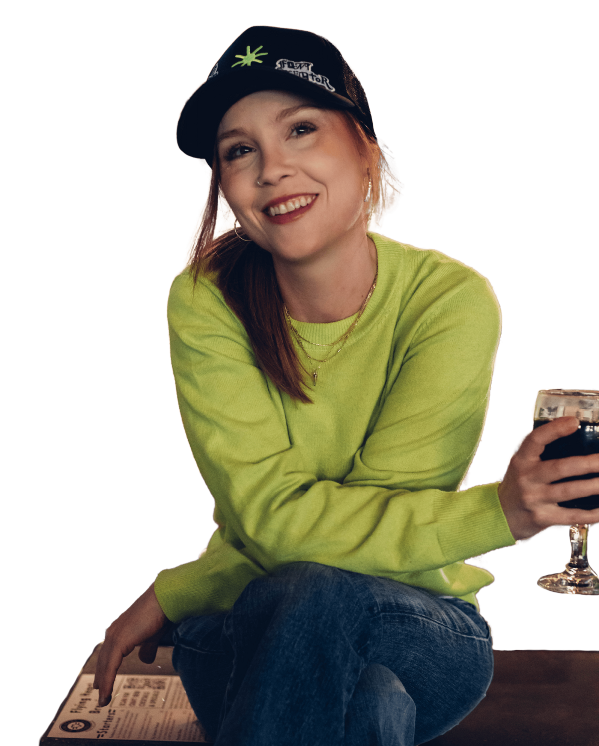 A woman, a talented Showit designer, smiling with her hand on her shoulder.