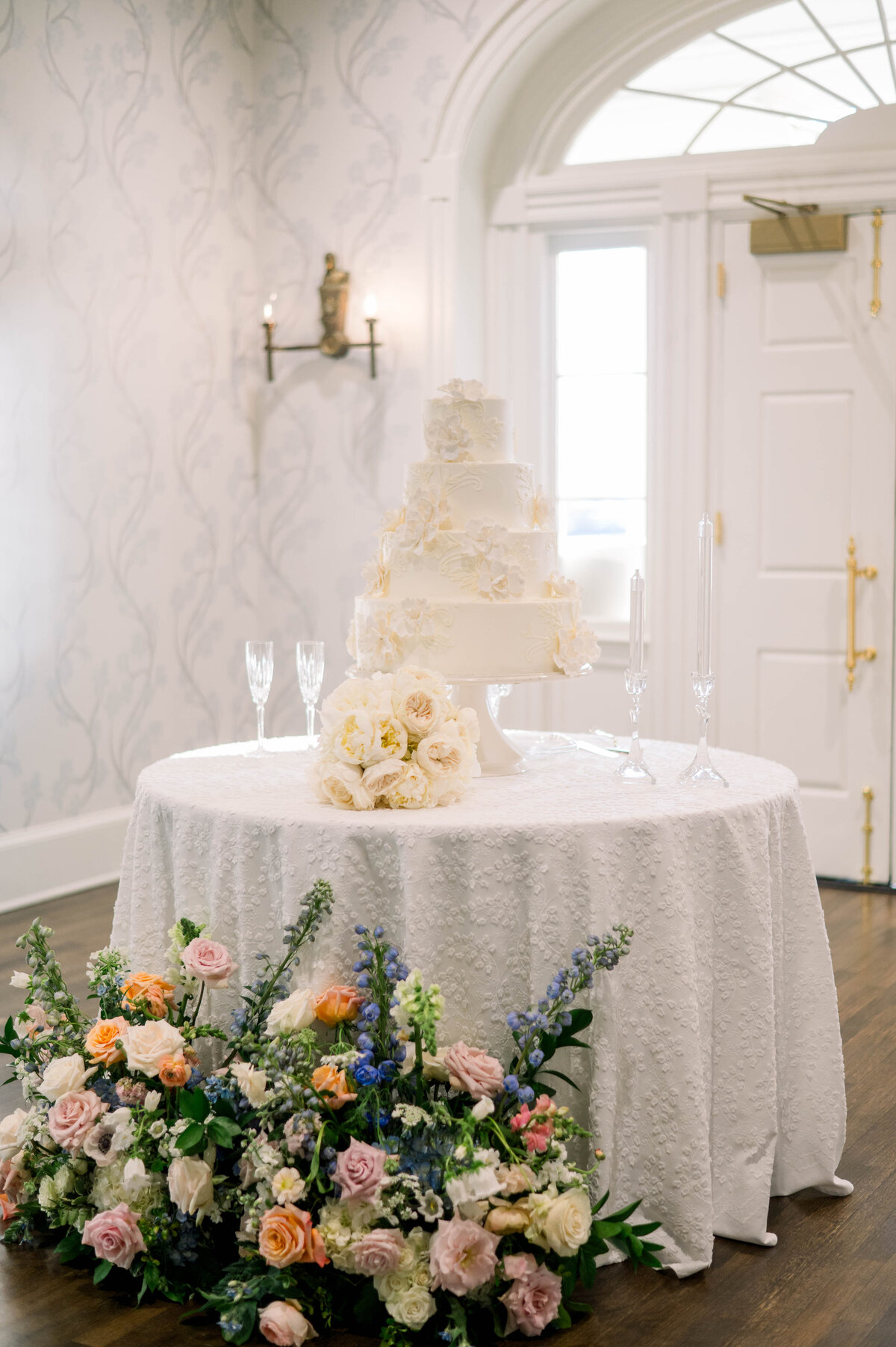 Wedding cake filled with florals at Southern wedding