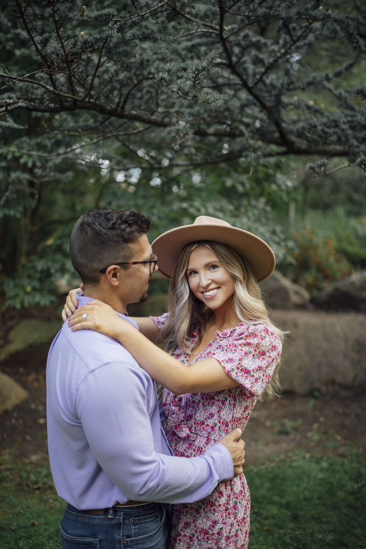 Woman smiling during engagement session couple photo at Sayen House and Gardens in Hamilton Township New Jersey