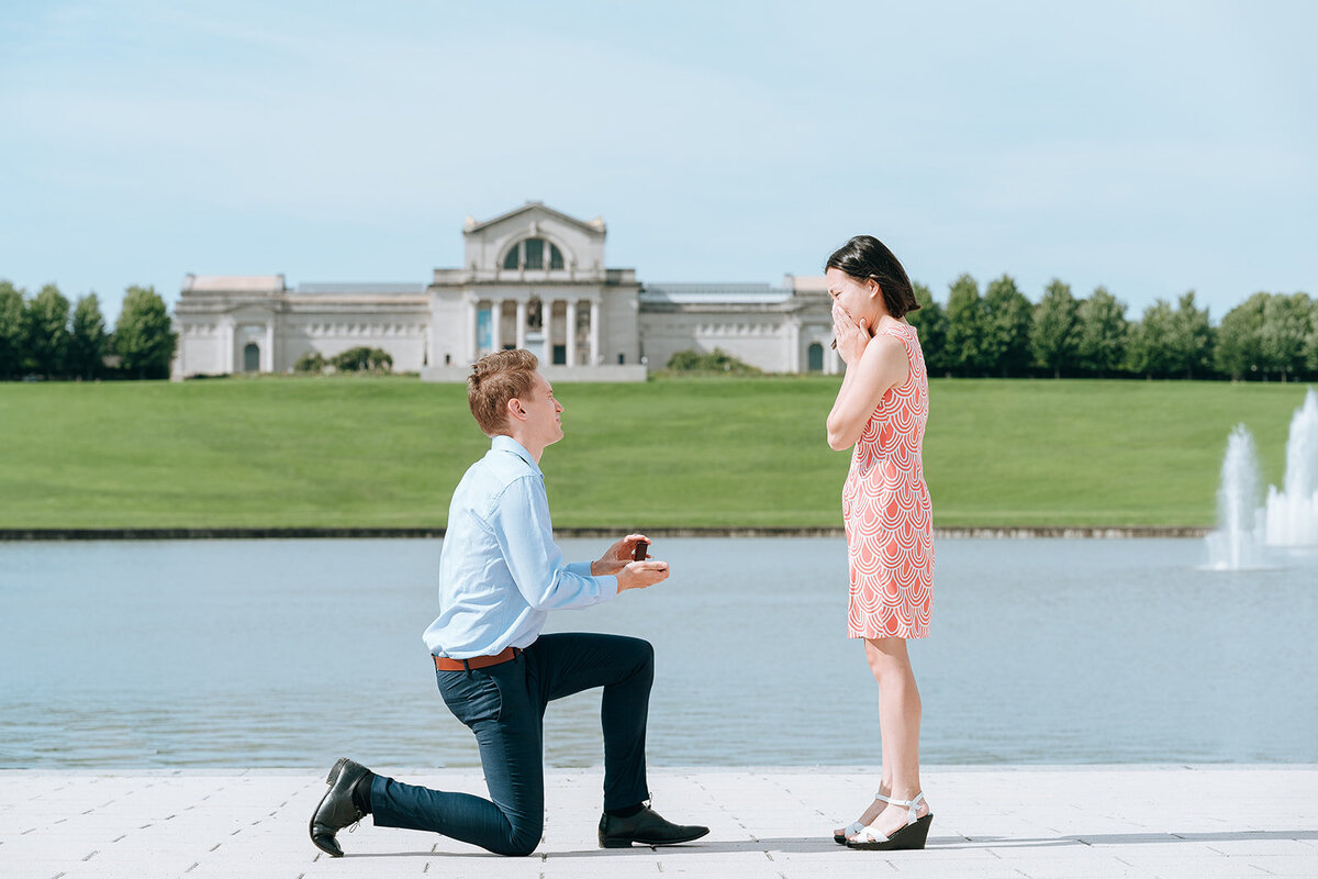 man proposing to girlfriend at the grand basin in forest park