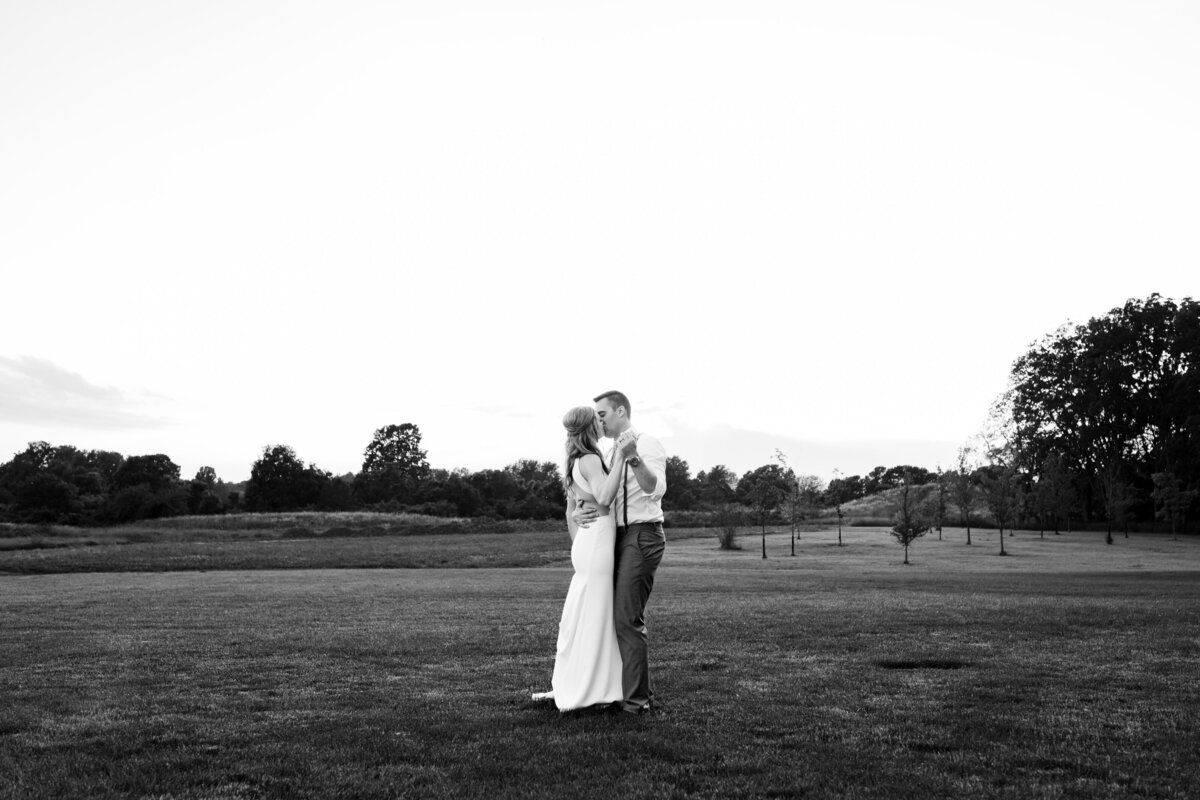 Groom and his bride share a kiss and dance on their wedding day. Location is a gold course in Northeast Ohio. Photo taken by Aaron Aldhizer