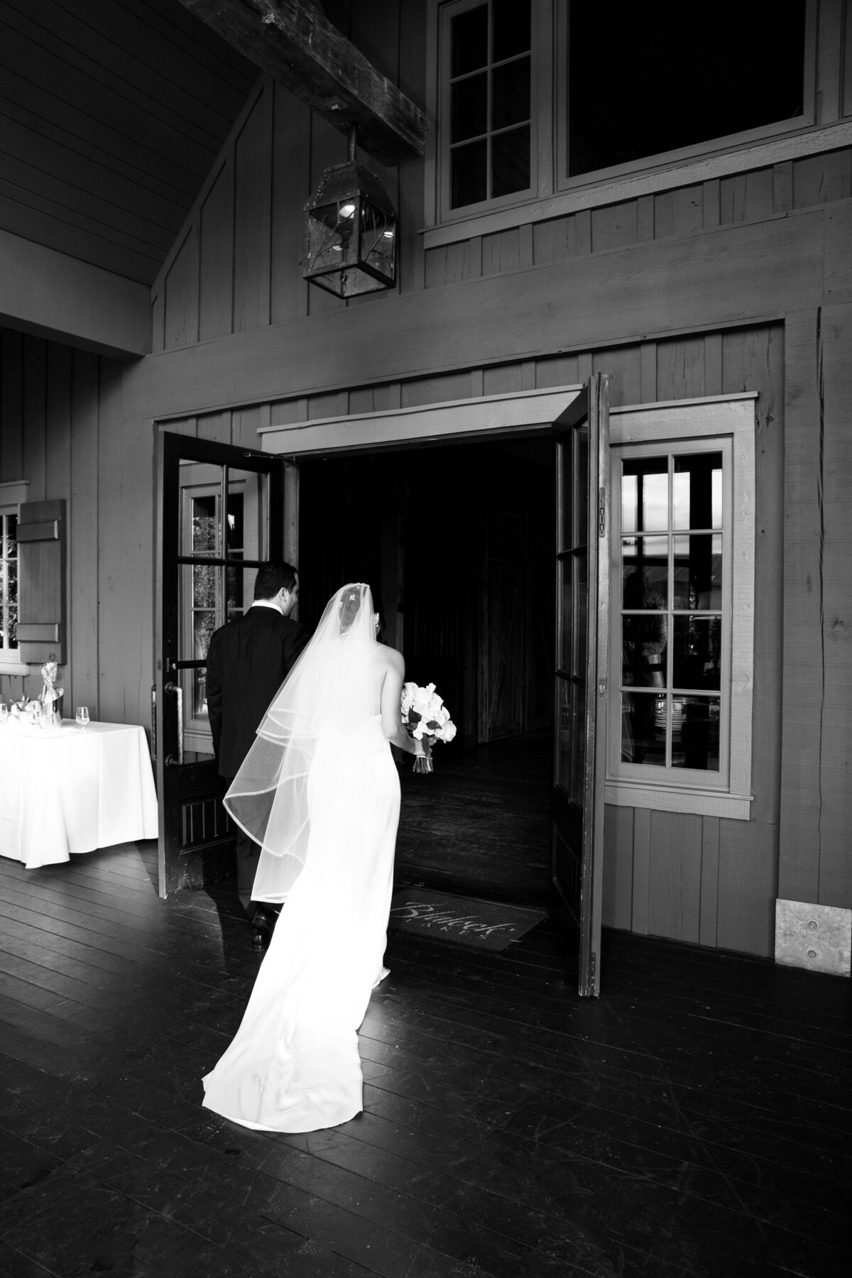 atlanta-wedding-photographer-bride-groom-walking-into-reception.
