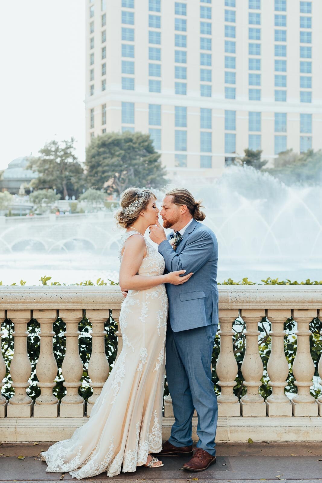 Elopement couple having an intimate moment in front of the Bellagio fountains