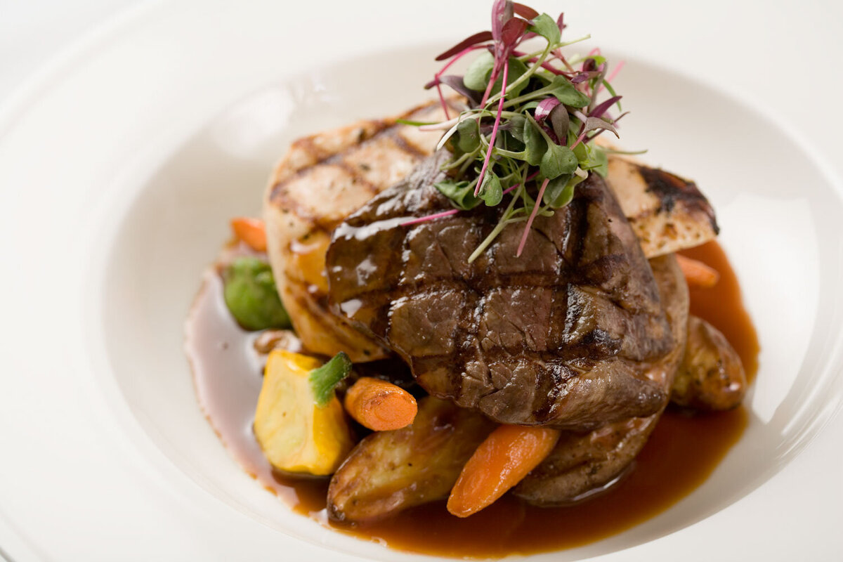 Surf and turf with shrimp, steak, and vegetables