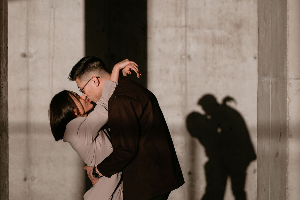 Couple kissing and amazing shadow in background captured by Lewis and Company, timeless and artful wedding photographer and videographer in Calgary, Alberta. Featured on the Bronte Bride Vendor Guide.