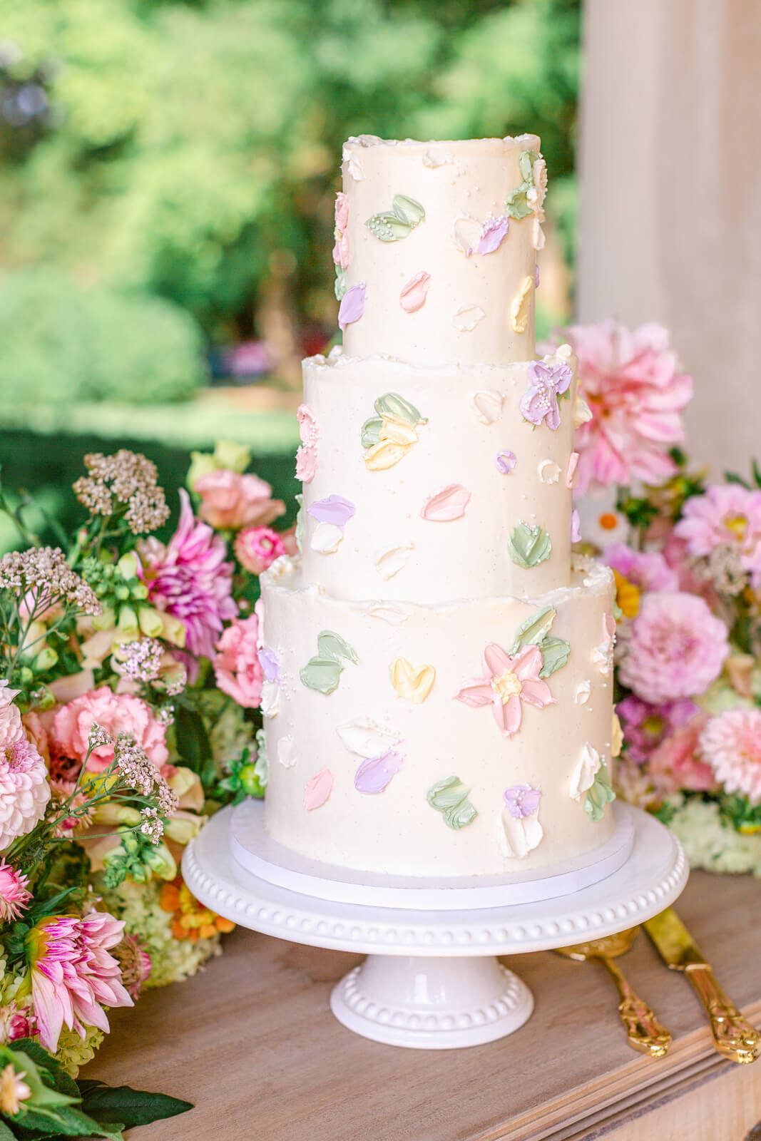 Gorgeous wedding cake with pastel flowers at Great Marsh Estate.