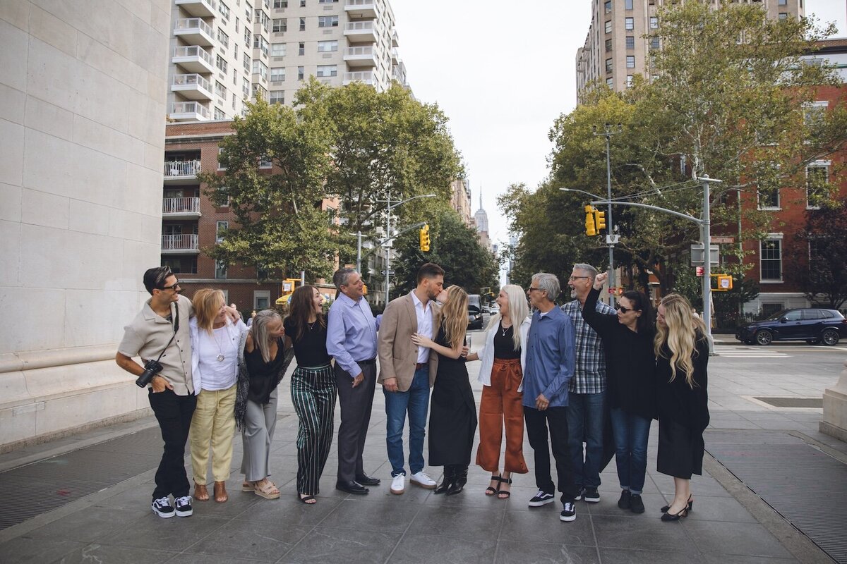 Group of friends and family gathering to surprise the couple after the proposal.