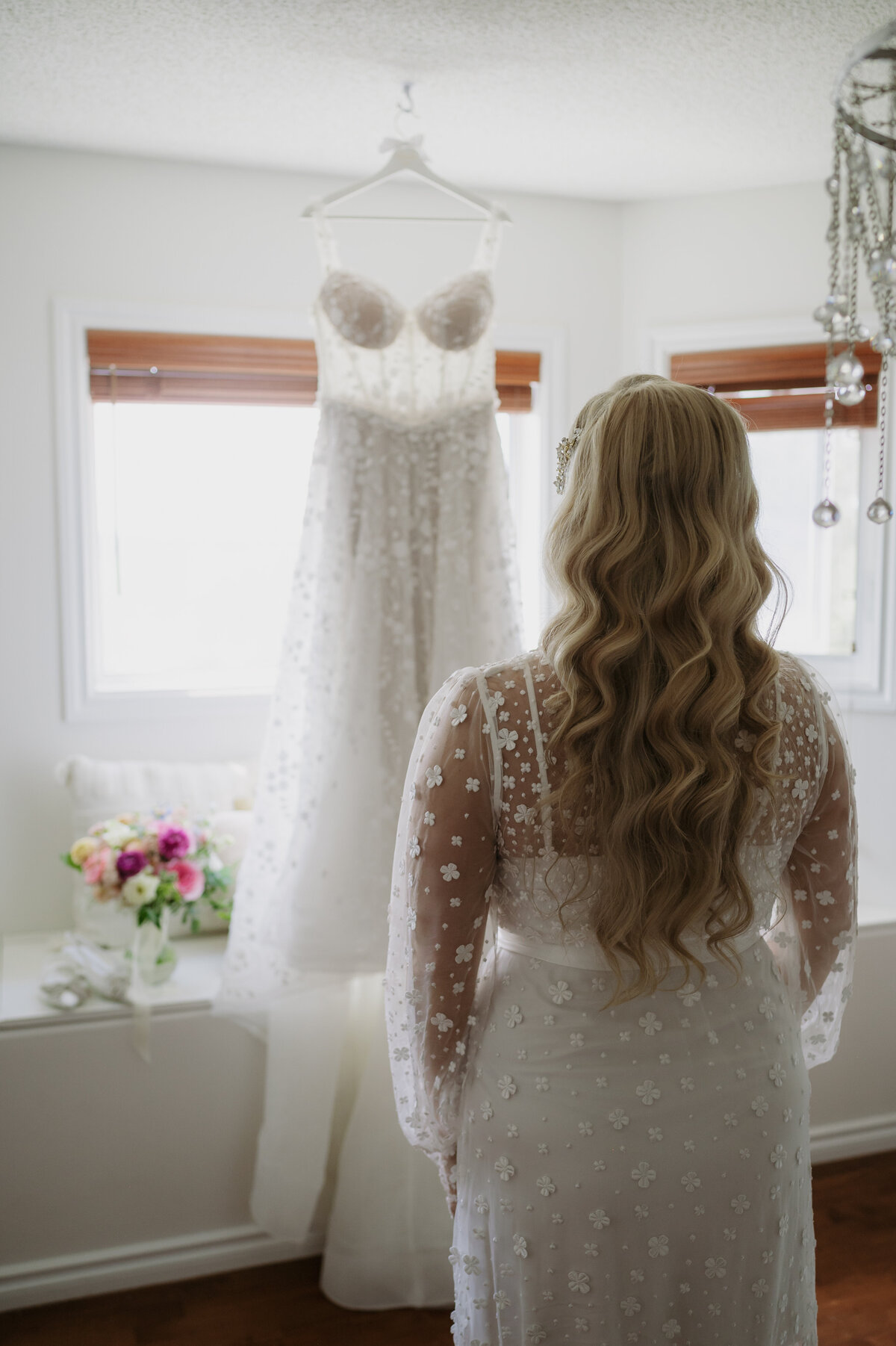 bride looking at wedding dress