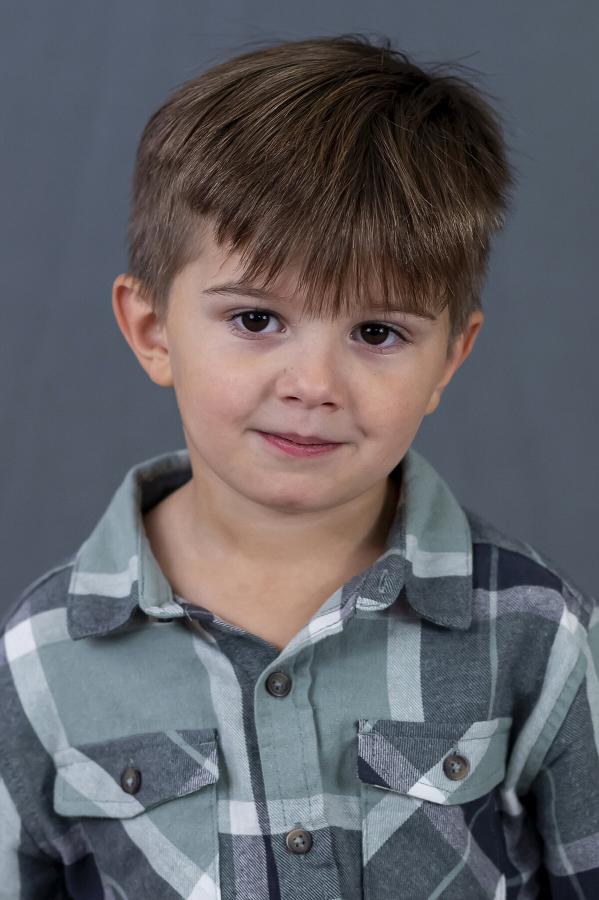 Preschool boy in Vancouver, BC  sitting for his back to school photographs