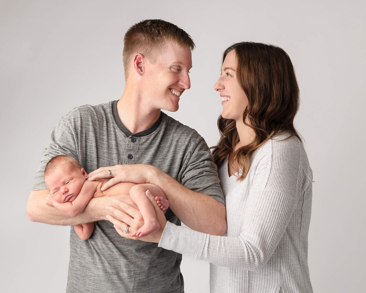 Mom, dad and newborn family portrait