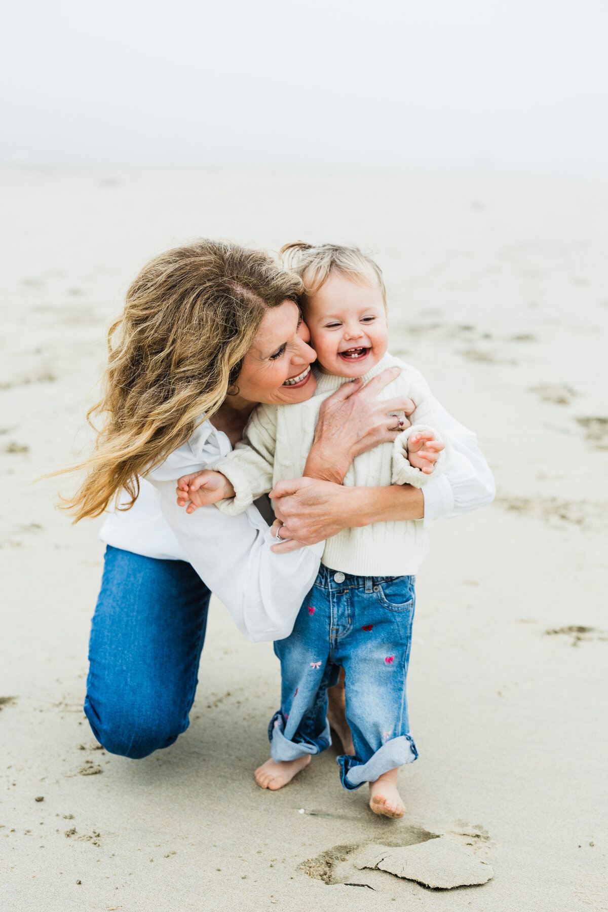 grandma-hugging-toddler-on-Manhattan_beach