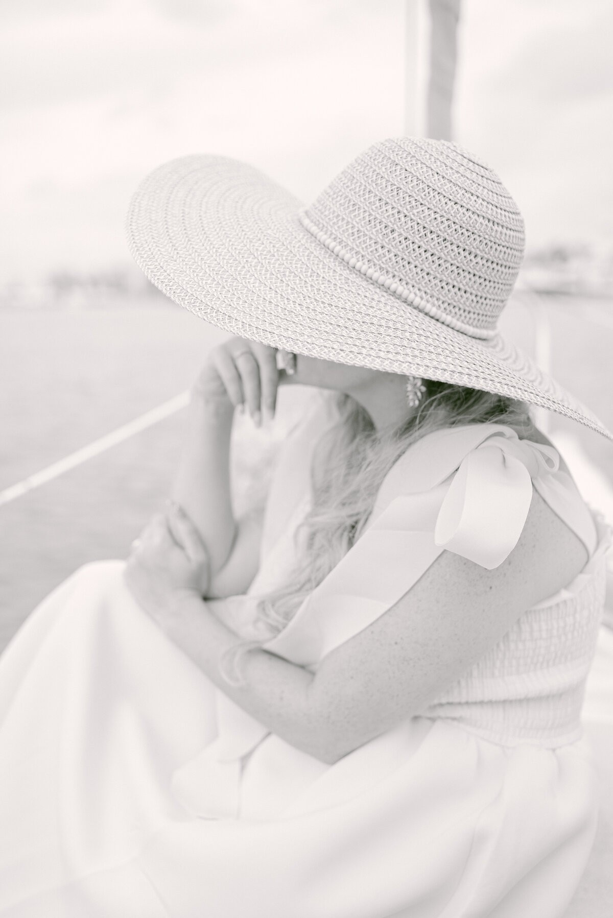 Lady wearing a sunhat looking away
