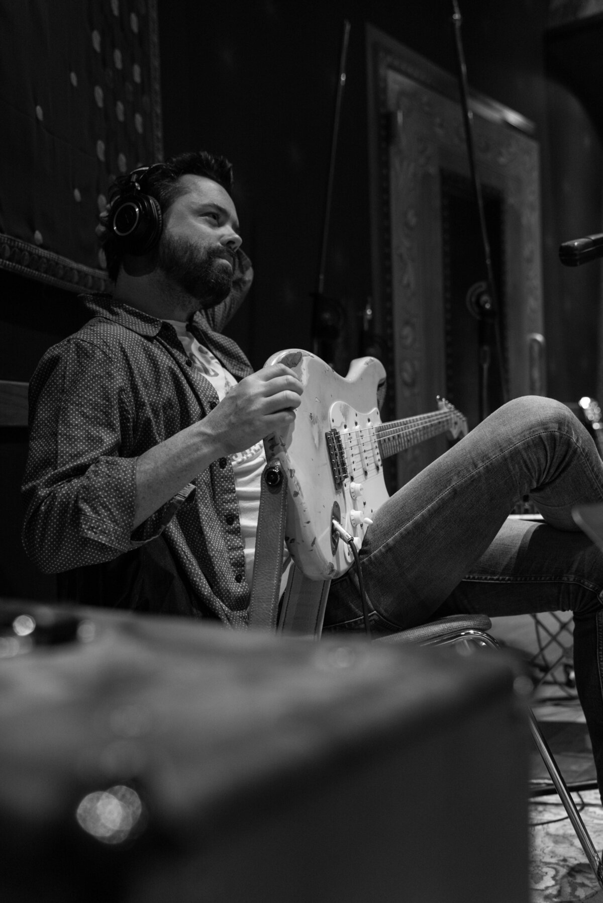 Brad Tursi holding guitar in recording studio