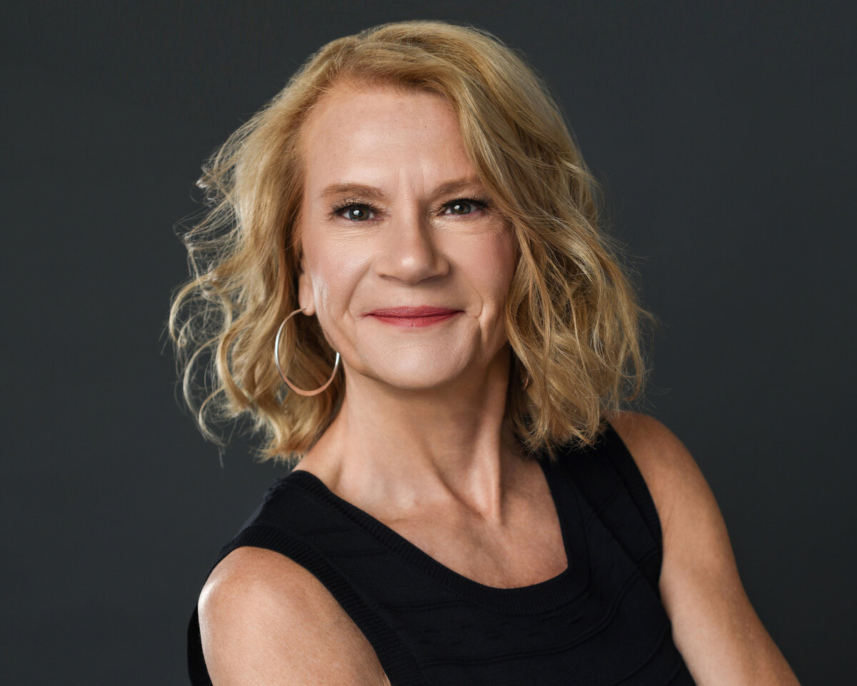 Beautiful woman in black sleeveless dress