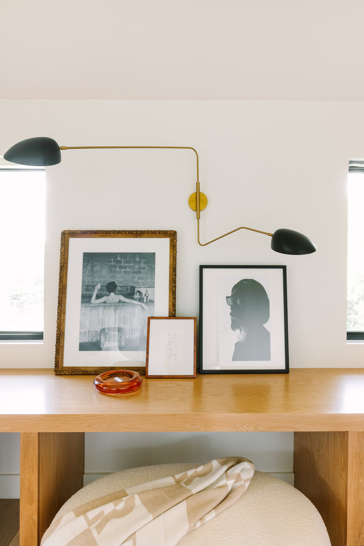 Leaning art collection with double  swing arm sconce