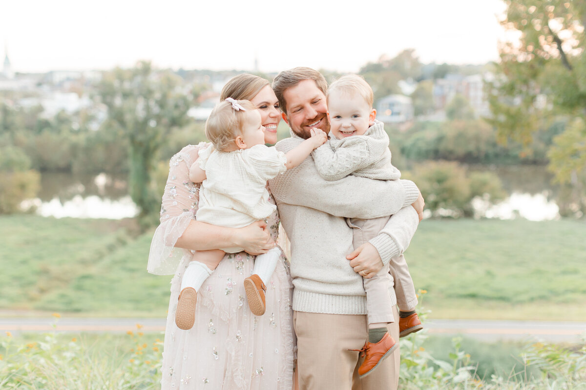 A fall photo in front of a river by Northern Virginia Family Photographer