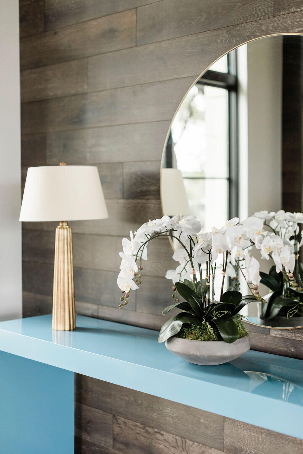 oyster creek studios austin barton creek blue side table with flowers modern lamp and mirror