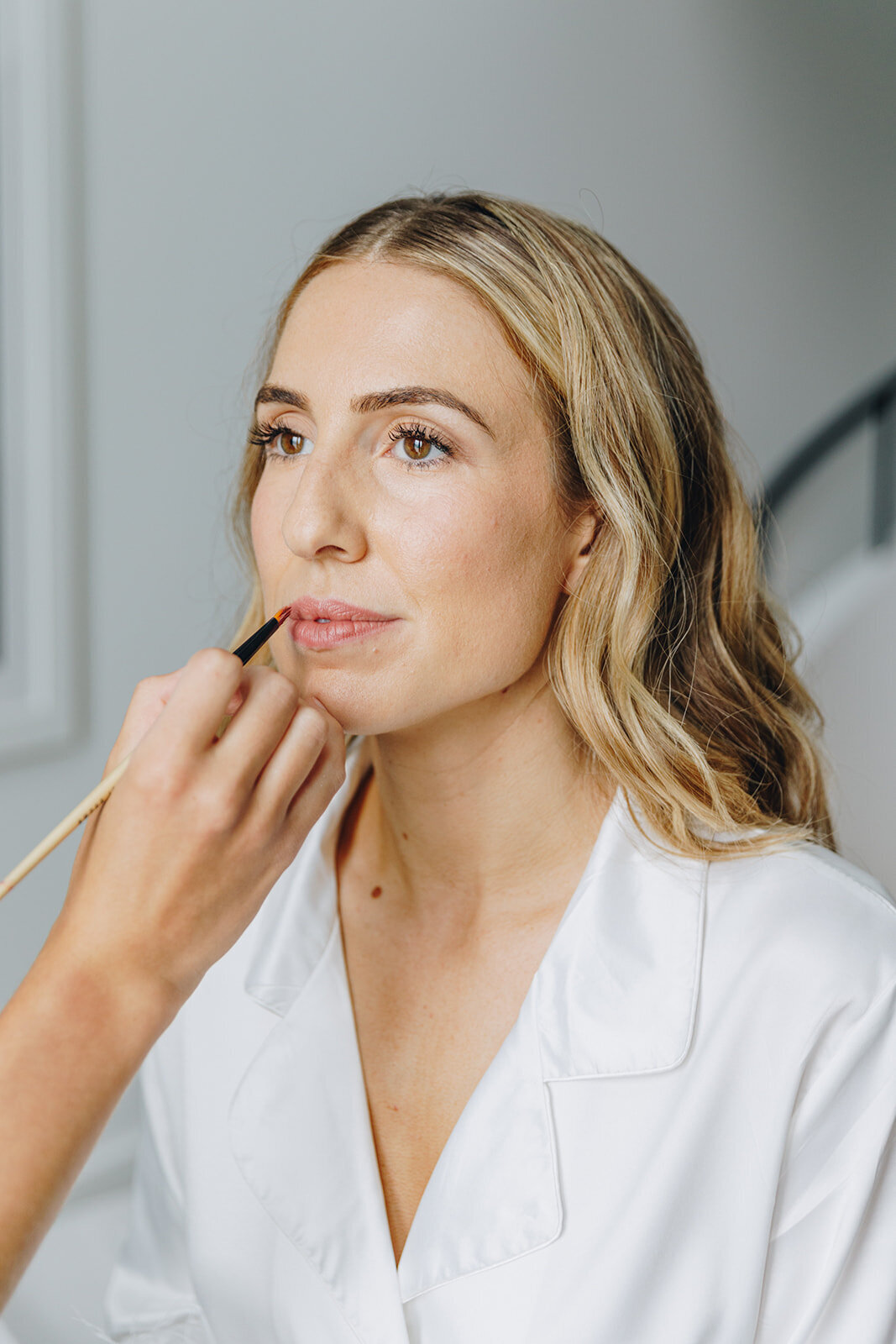 Brooklyn bride getting her makeup done