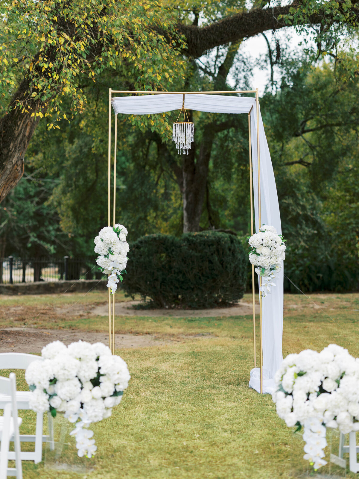 Shaoleen & Colin American Black + White Wedding- Ceremony - Details 1 tall gold arbor with white chiffon details