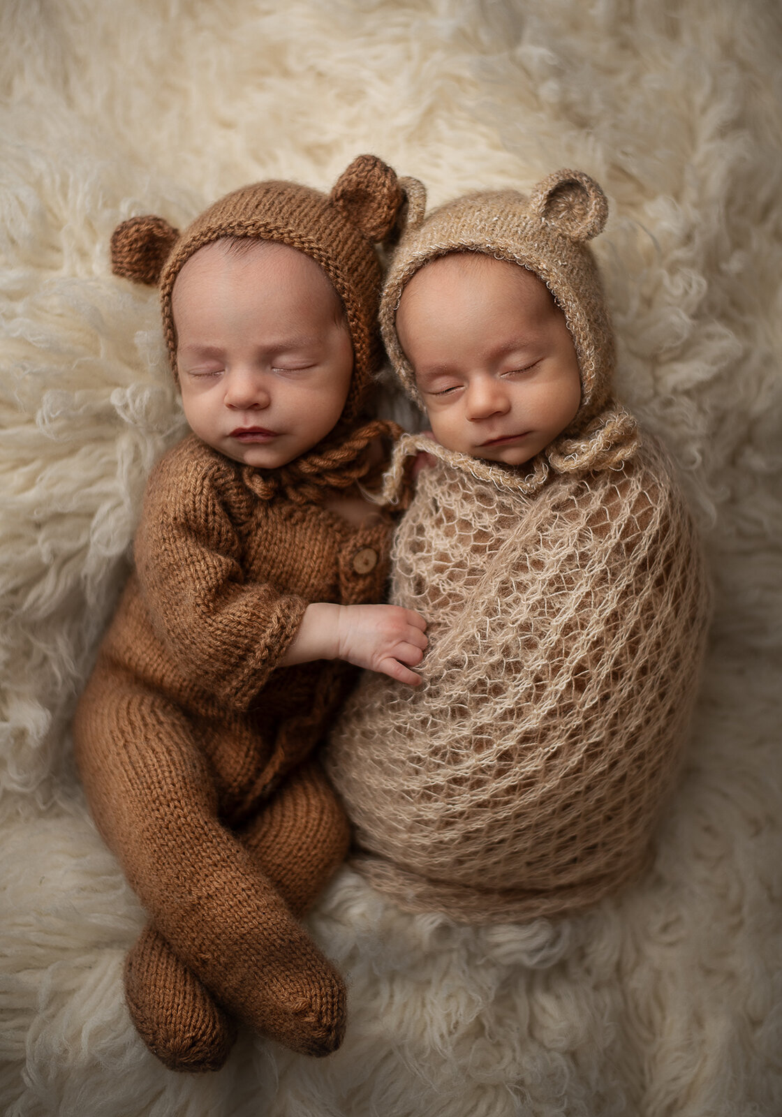 twin newborns in bear outfits