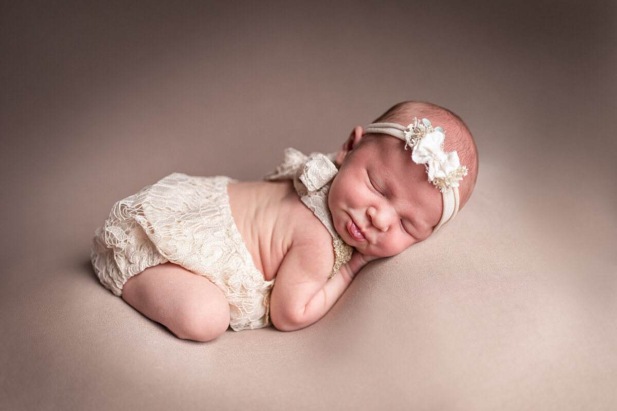 posed baby girl with headband and outfit newborn photographer northeast fort wayne bluffton indiana