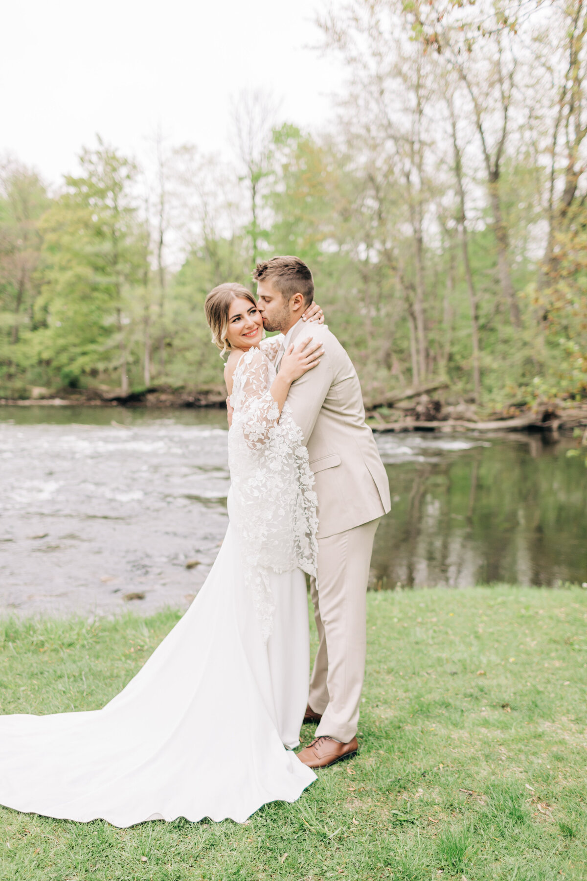 bride and groom hugging