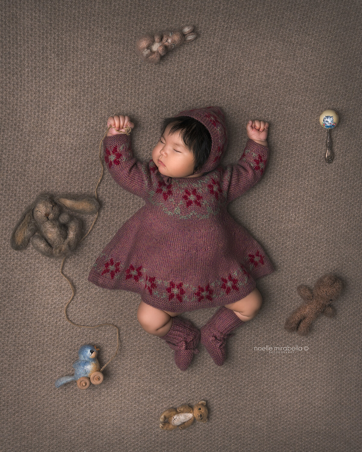 Sleeping baby girl in handmade knits. miou Kids. Vintage baby toys.