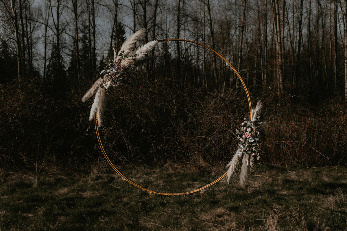 Gold circle wedding arch from beholden events and design