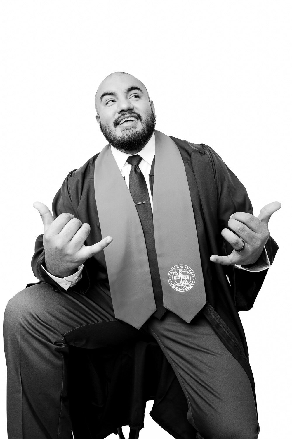 Contemporary graduation portrait of a male graduate, captured in a bright, editorial-inspired look.