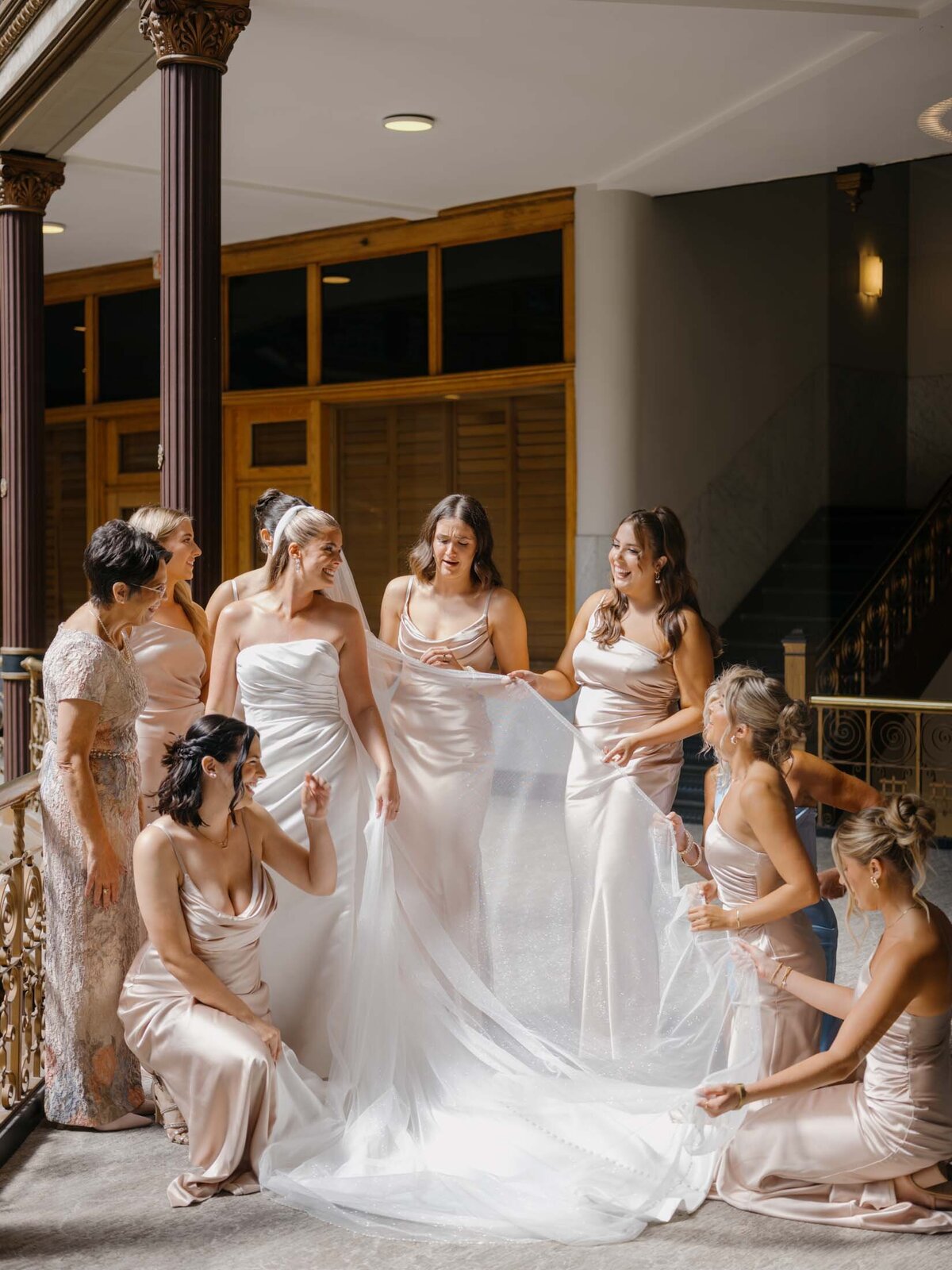 Bridesmaids first look with bride at The Arcade Hyatt Regency Cleveland