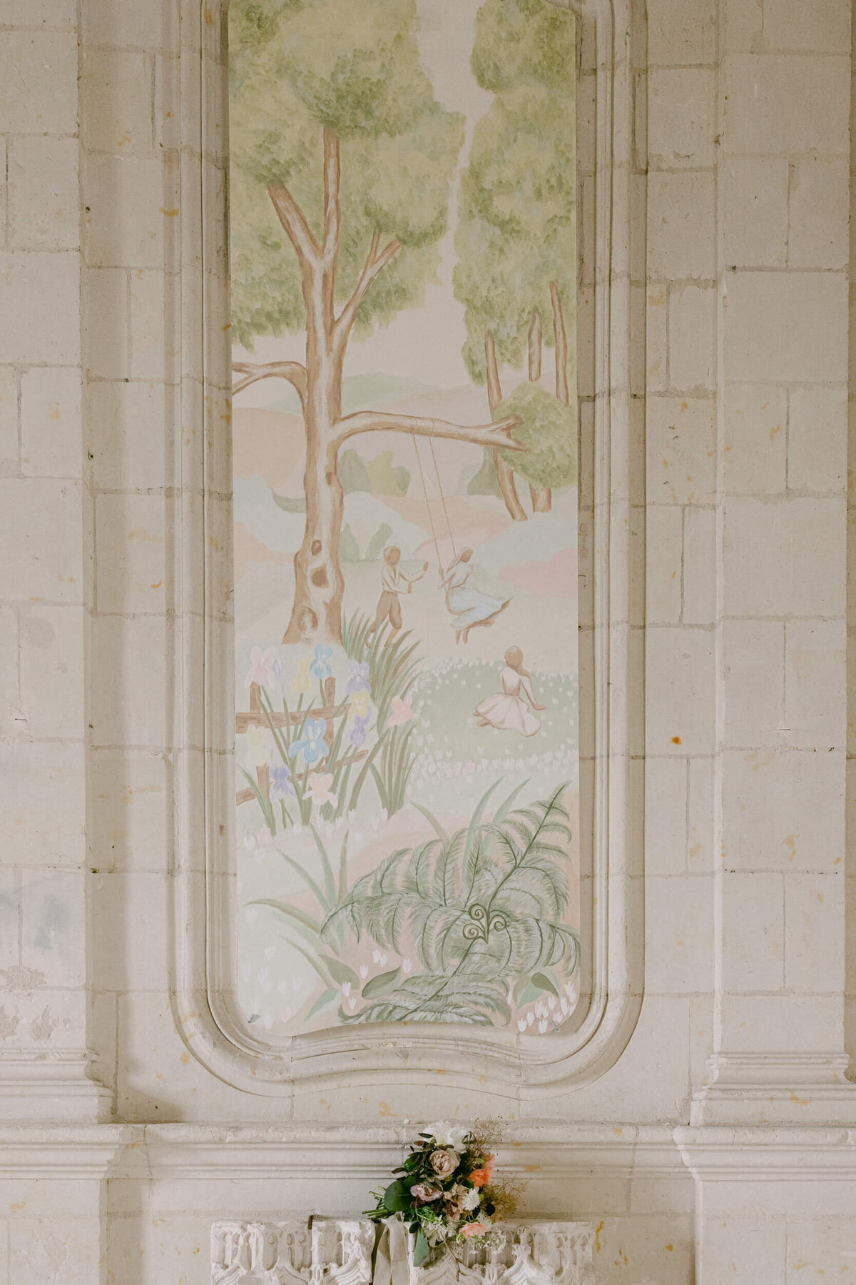 A wedding photo of the wall paintings inside Chateau de Jalesnes in France