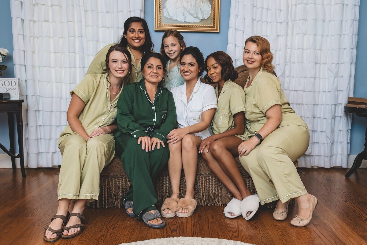 bride and bridemaids smiling in loungewear
