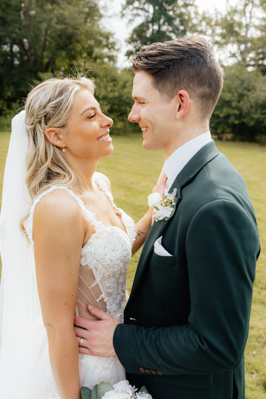 Bride and groom portraits posing at Aurora Meadows.