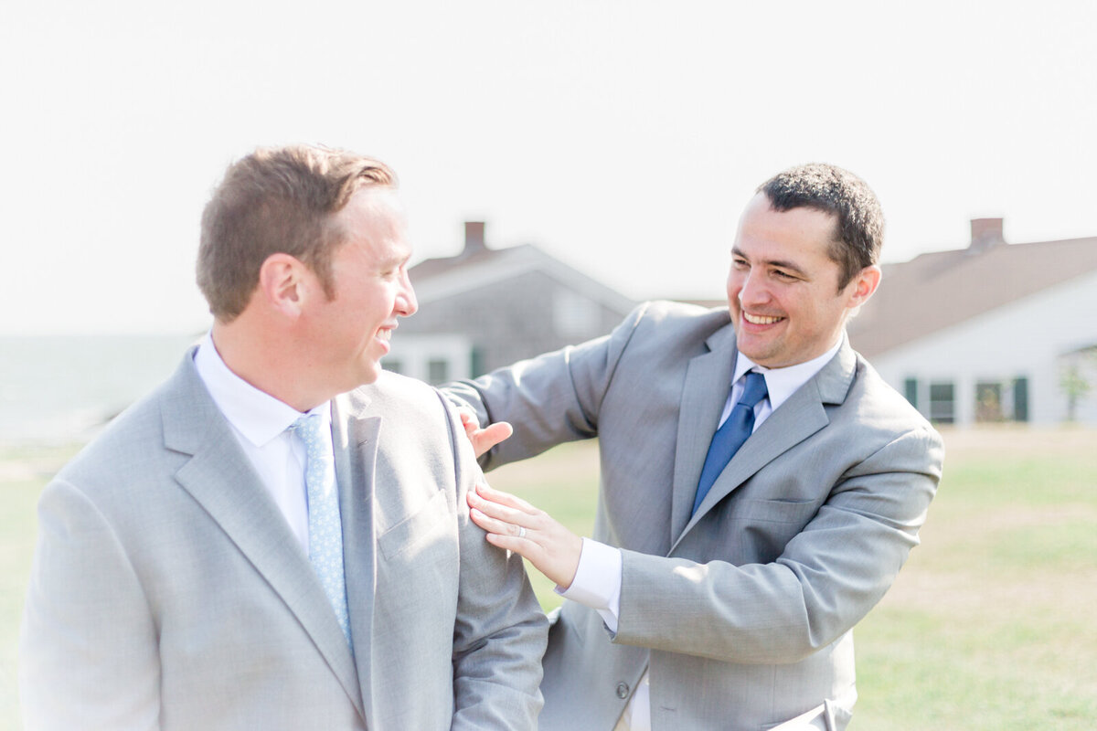 Groom getting ready at the Light House in on Cape Cod