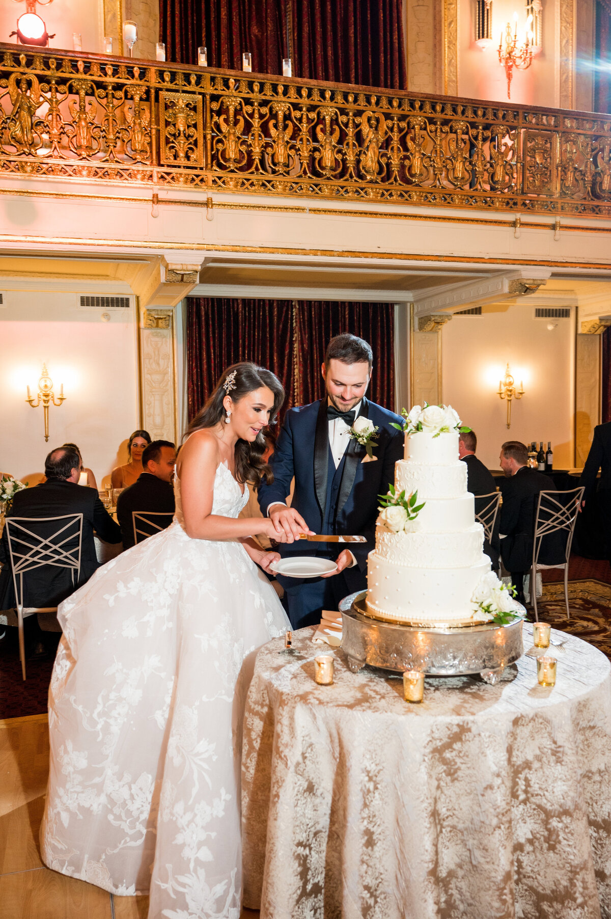 wedding reception cake cutting married couple
