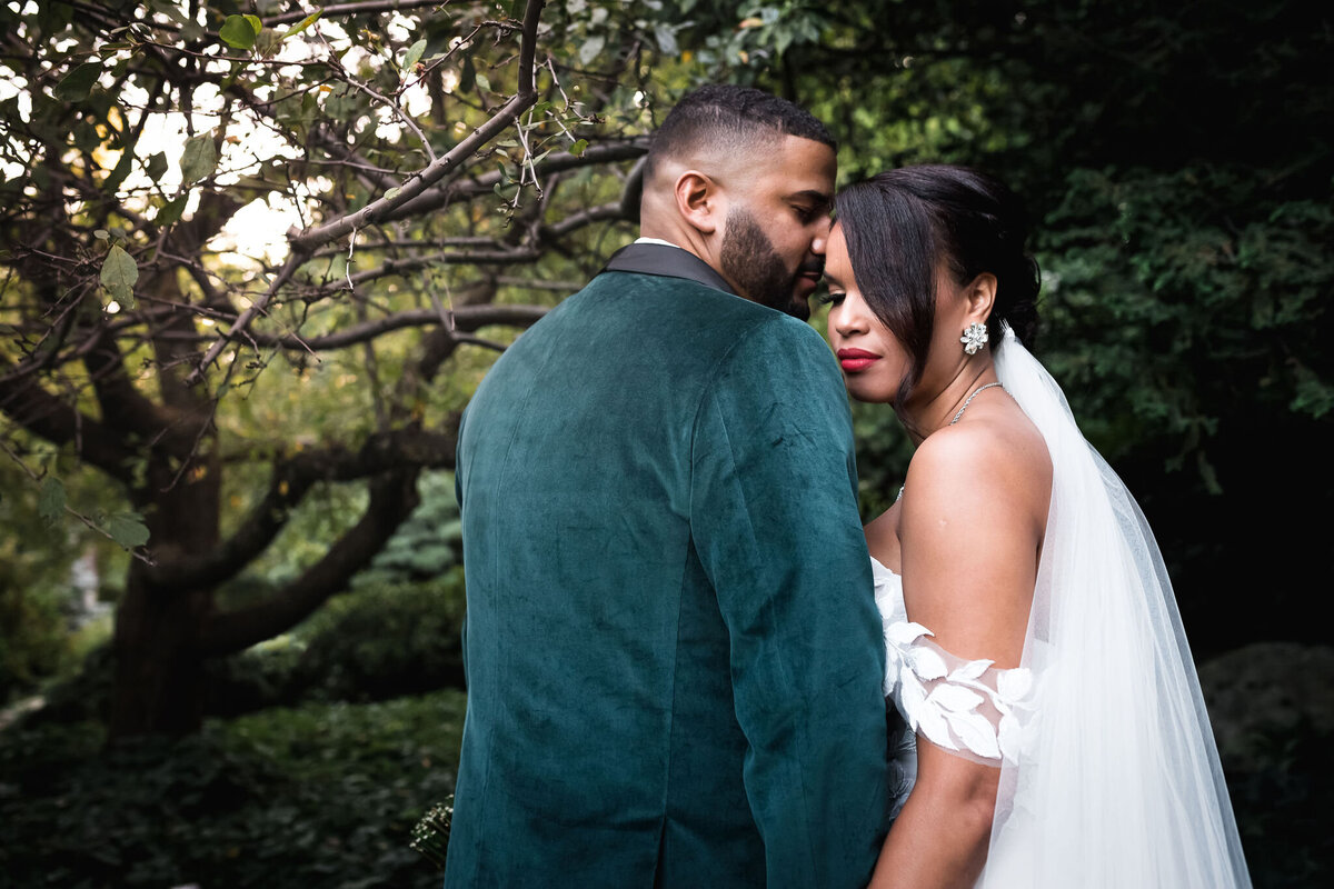 A quiet and intimate moment for bride and groom in the secret garden at The Gardens at Uncanoonuc Mountain in Goffstown NH by Lisa Smith Photography