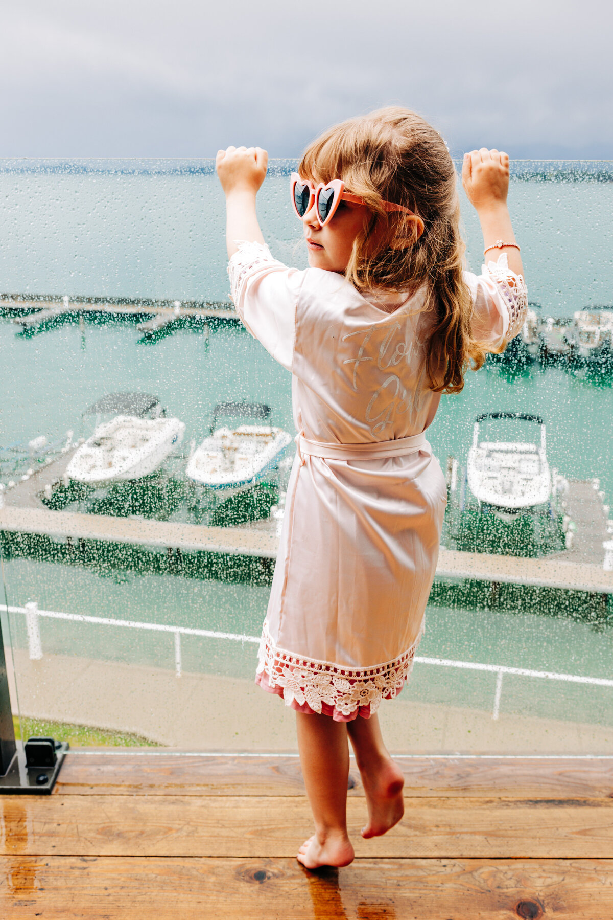 Flower girl in pink robe in the Casino Suite at Kwataqnuk Resort in Polson, MT