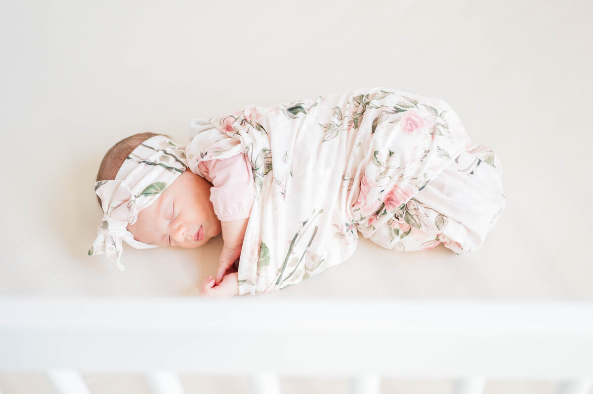 Newborn girl in crib taken in Westwood, MA by best Westwood newborn photographer