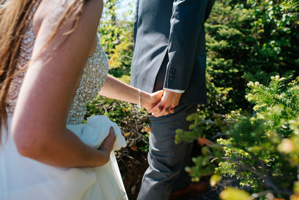 close up of bride and groom holding hands at mount mansfield adventure elopement in stowe vermont