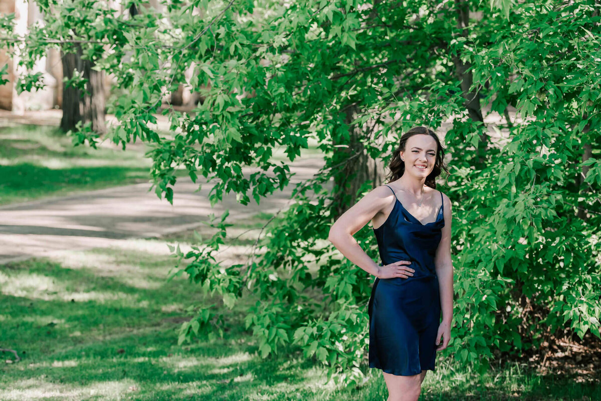 On campus, a half body portrait of a young lady who graduated from university. 