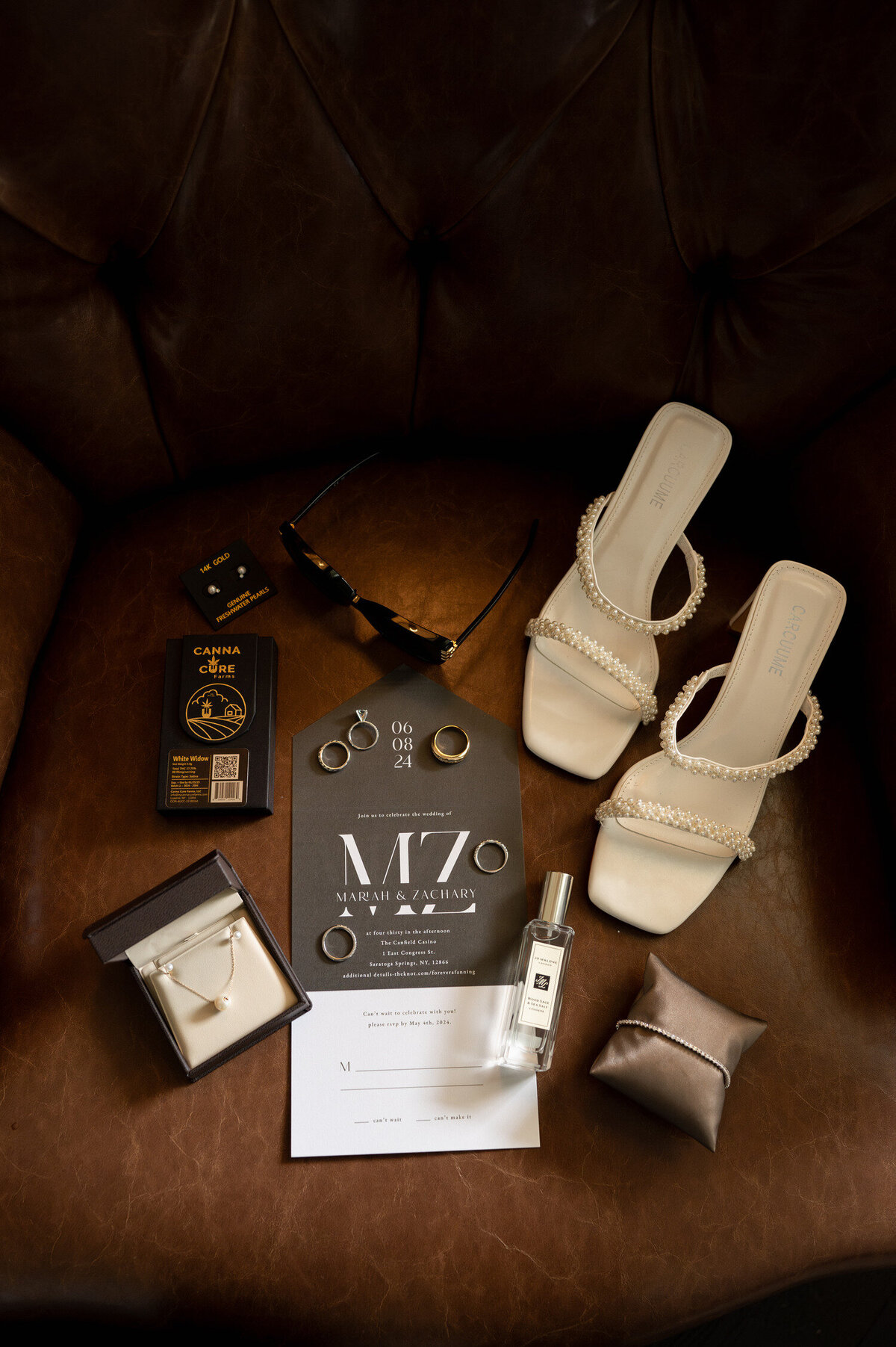 A flat lay photo of all the important details at the Adelphi Hotel in Saratoga Springs, NY.