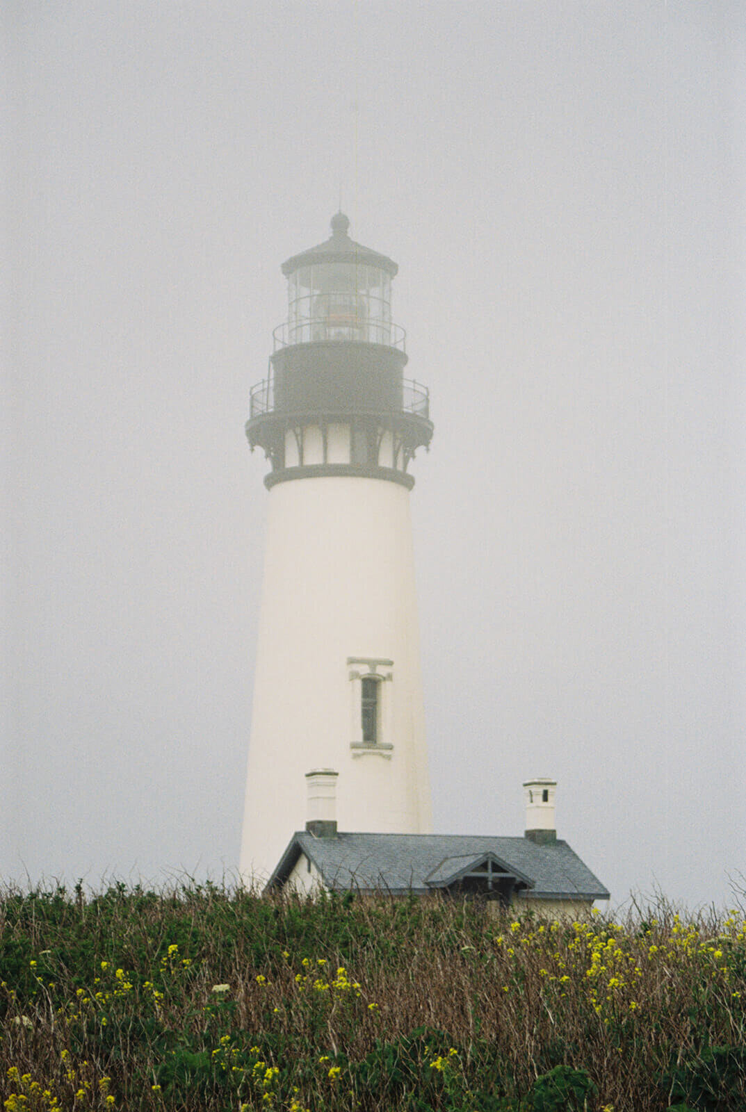 Yaquina Head Lighthouse on a foggy day. 