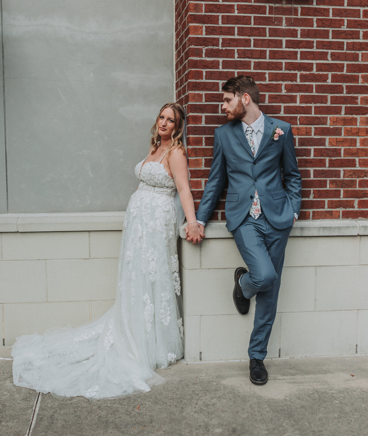 A romantic portrait of a bride and groom embracing lovingly at the Hampton Roads Event Center, beautifully captured by Quinn Photography LLC.